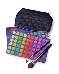 Black cosmetic bag and palettes of colored eyeshadow for makeup with brushes