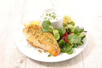 chicken breast with crumbs and sauce