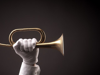 Hand with an old trumpet