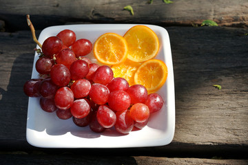 grape and sliced oranges