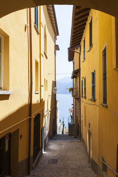 An old alleyway with lake view in Varenna, Lake Como, Lombardy, Italy.