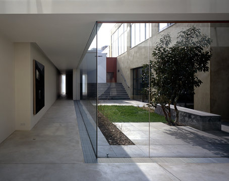 Interior living space and external garden area separated by picture windows