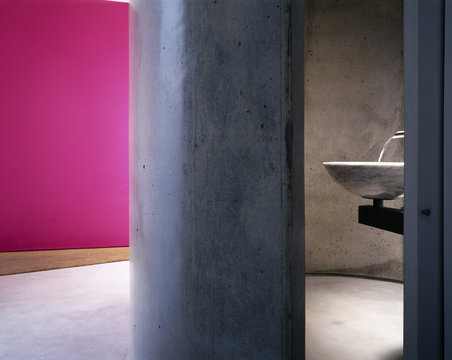 Modern sink and bathroom with pink walls