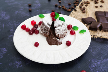 Chocolate fondant with cranberry sauce.