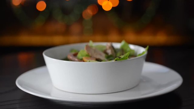 mixing chicken salad in a plate
