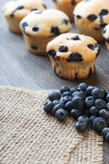 muffin with blueberries on a wooden table. fresh berries and swe