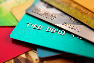 stack of multicolored credit cards, close up view