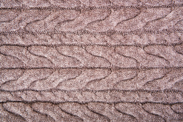 Brown structure of a  knitted woolen fabric background