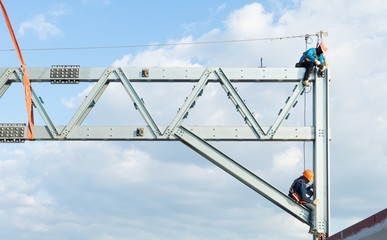Workers working on at high .installation steel roof