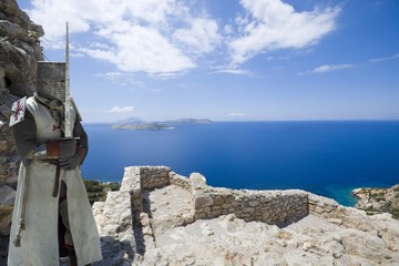 Medieval knight in ruined castle built by the Knights of Saint John on top of craggy rock in Kritinia, Rhodes, Greece