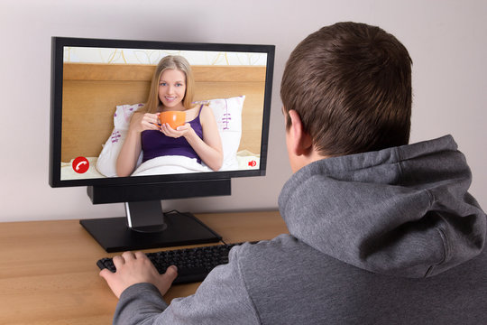 man videochatting with girlfriend at home