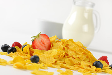 jug og milk and corn flakes with fruits