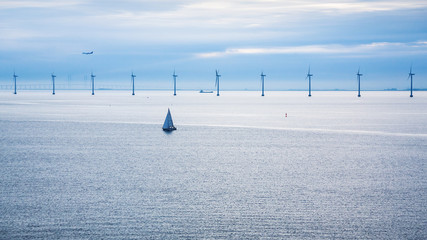 airplane and ships near offshore wind farm