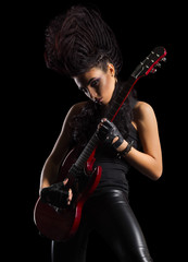Fototapeta premium Young woman hard rock musician