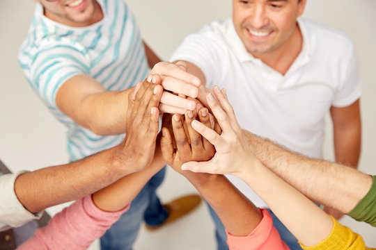 International Group Of People Making High Five