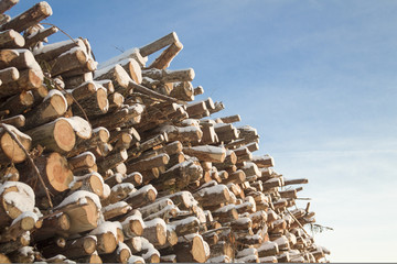 Wall made of stacked wood.