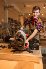 Carpenter is studying,works with the tools without protection