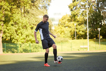 soccer player playing with ball on field