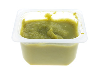 Container of green peas baby food isolated on a white background.