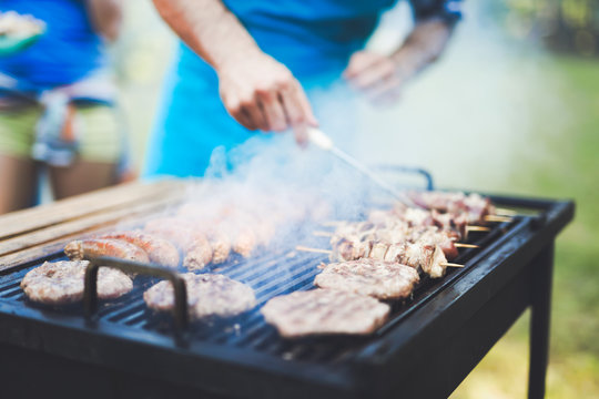 Happy Outgoing People Enjoying Bbq