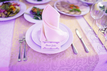 plate with card signed name of guest on white paper