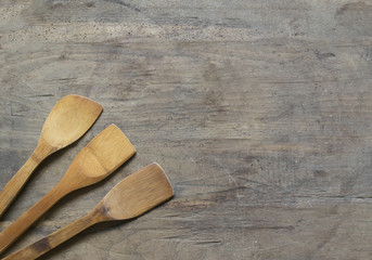 Wooden cutlery on old , wooden, rusty background