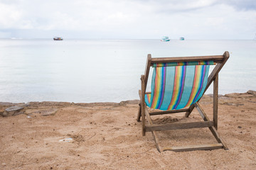 Sun chair on the beach facing the sea
