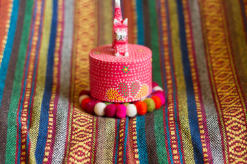 colorful handmade fabric and colorful wool .

