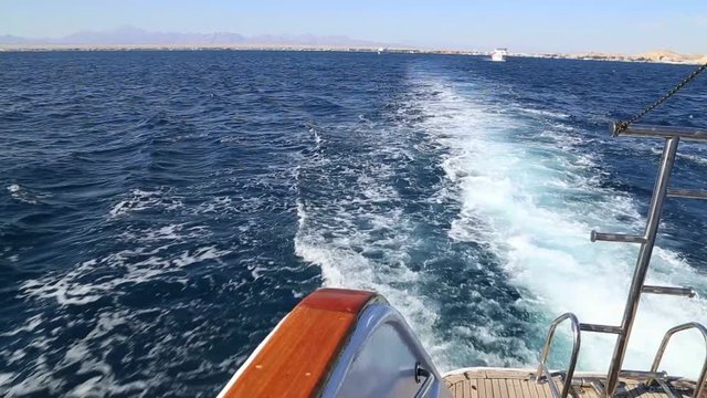 Sea landscape view from back side of moving yacht. Real time full hd video footage.