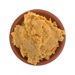 Hummus dip in a bowl isolated on a white background.