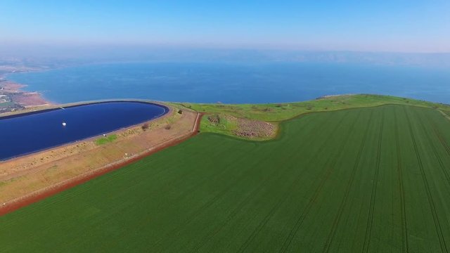 Water reservoir on top of a cliff, overlooking the sea of Galilee - Aerial footage