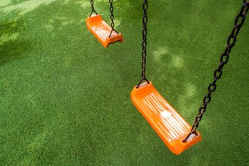 Swing seat on the artificial grass