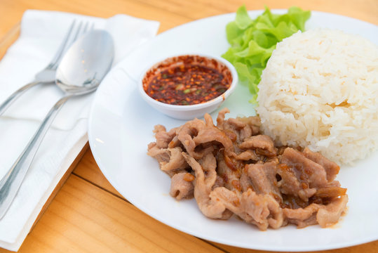 Close up of Fried pork with garlic and pepper on rice, Thai food style.