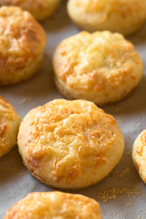 Hungarian traditional Cheese Pogacsa savory baked bread-like pastry, photographed with natural light (Selective Focus, Focus one third into the image)