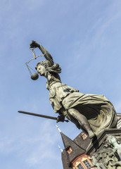 lady justice  under blue sky