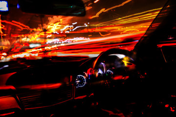 Blurred light trails on the street from in side a car tn Bangkok
