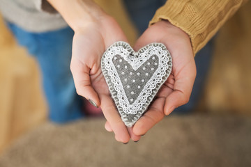 Fototapeta premium close up of woman and man hands with heart