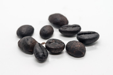 Black coffee bean isolated on white background.