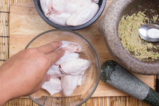 chef prepared chicken wings before cooking with seasoning