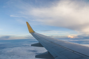 Looking at the wings during flight on airspace of Thailand.