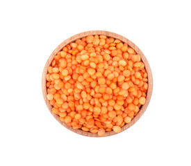 Lentils in wooden bowl isolated on white background, top view