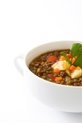 Lentil soup in a bowl, isolated on white background
