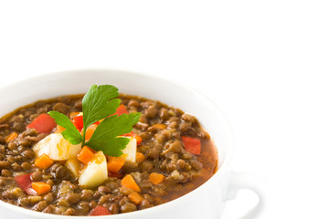 Lentil soup in a bowl, isolated on white background
