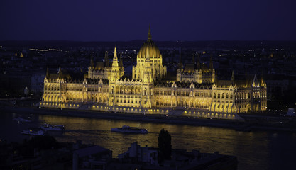 Fototapeta na wymiar Budapesti Hungary Parliament building at night with yellow light
