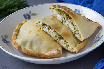 Homemade pie with  cottage cheese and fresh dill.