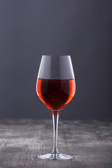 Classy glass of red wine on wooden table