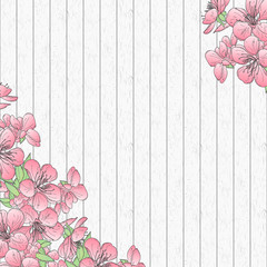 Wooden background with cherry flower frame