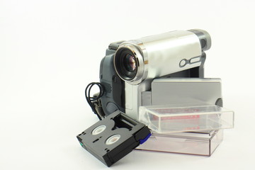 Digital video camera with tape on a white background