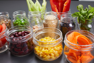Fototapeta na wymiar ingredients in jars for vegetable dish