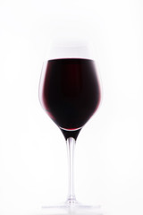 Classy glass of red wine isolated on white background